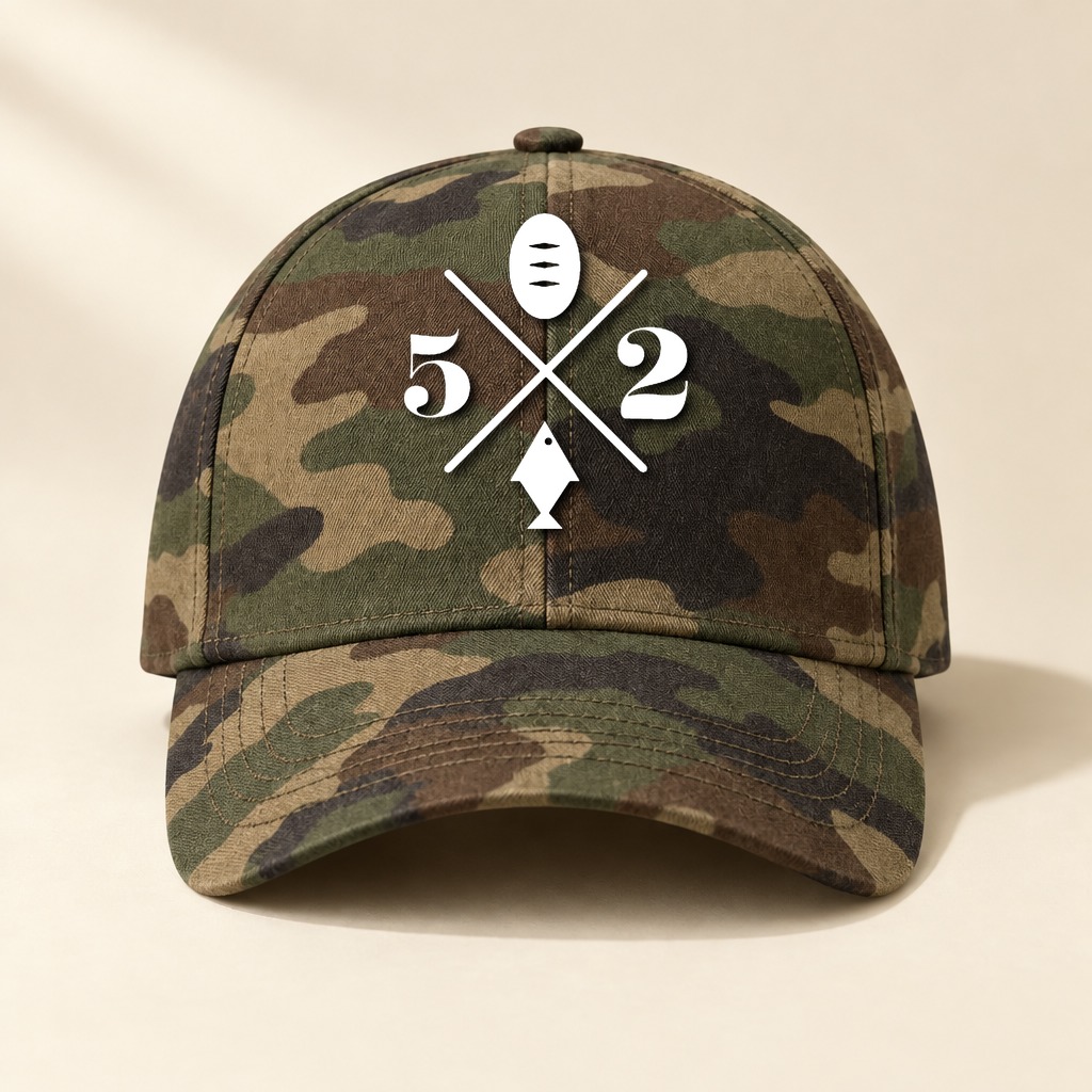 A camouflage baseball cap in greens and browns with the 5 Loaves 2 Fish logo printed in white on the front panel