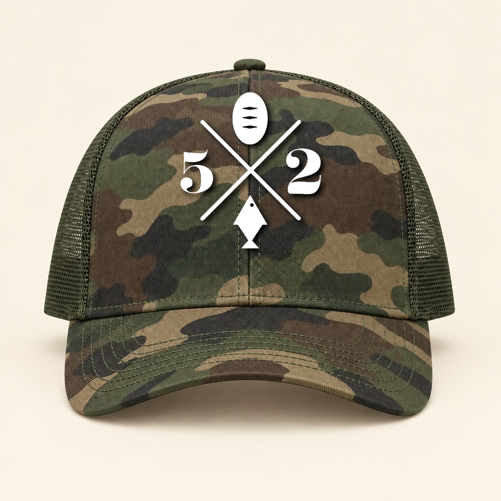 A camouflage trucker hat with a mesh back and the 5 Loaves 2 Fish logo printed in white on the front panel